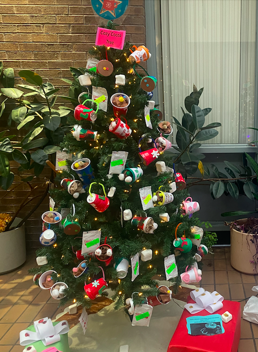 Christmas tree decorated with hot chocolate ornaments made by students